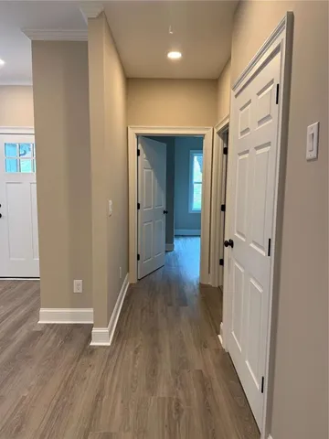 wooden floor in a hall with an empty room