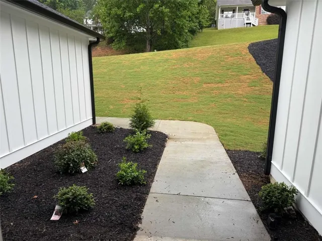 a view of a patio with a yard