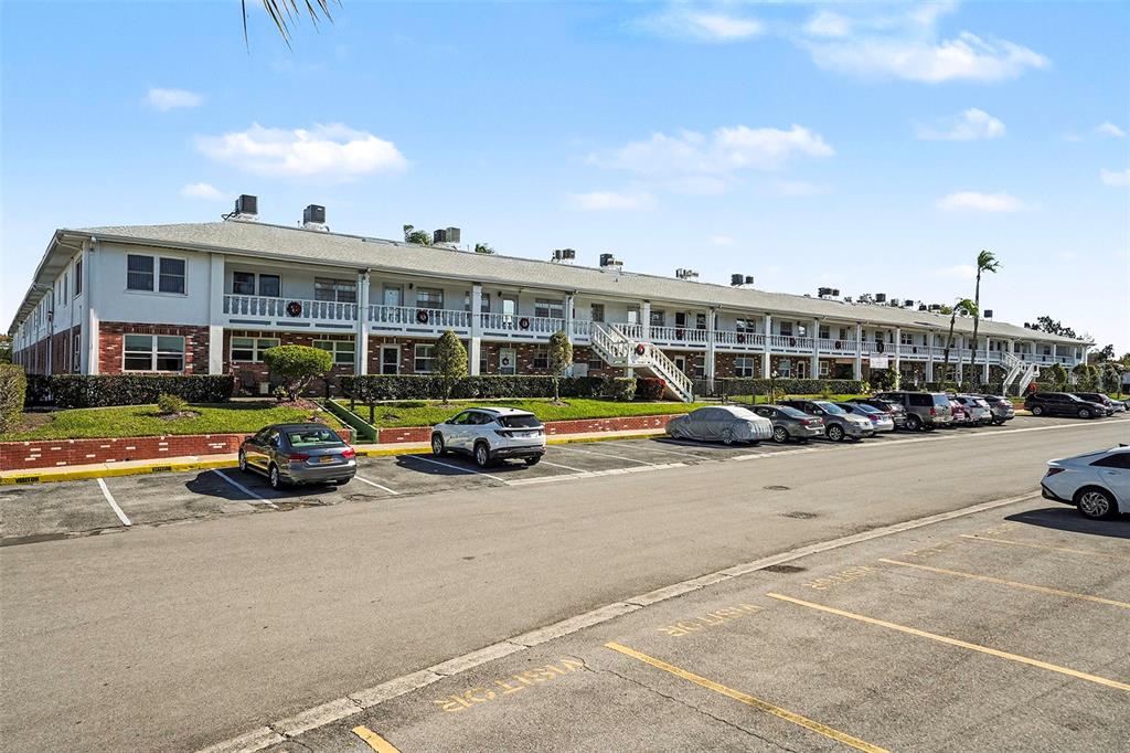4742 Azalea Drive, Unit 103 New Port Richey, FL 34652 - Photo 2 of 33 a view of a street with cars