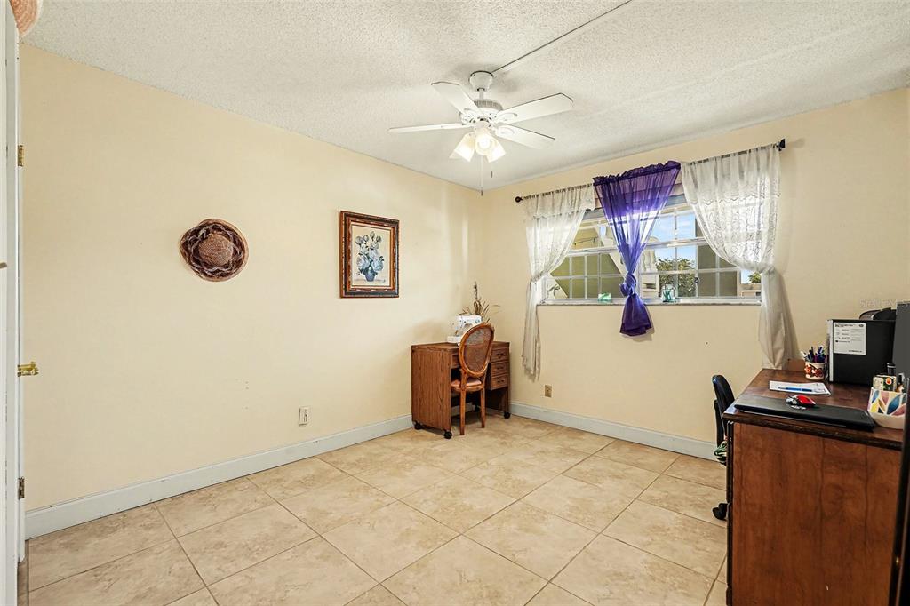 4742 Azalea Drive, Unit 103 New Port Richey, FL 34652 - Photo 21 of 33 a view of a workspace with furniture