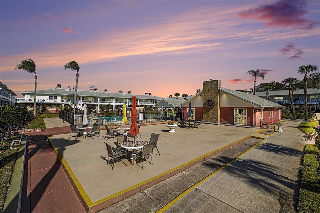 4742 Azalea Drive, Unit 103 New Port Richey, FL 34652 - Photo 25 of 33 a view of a terrace with chairs