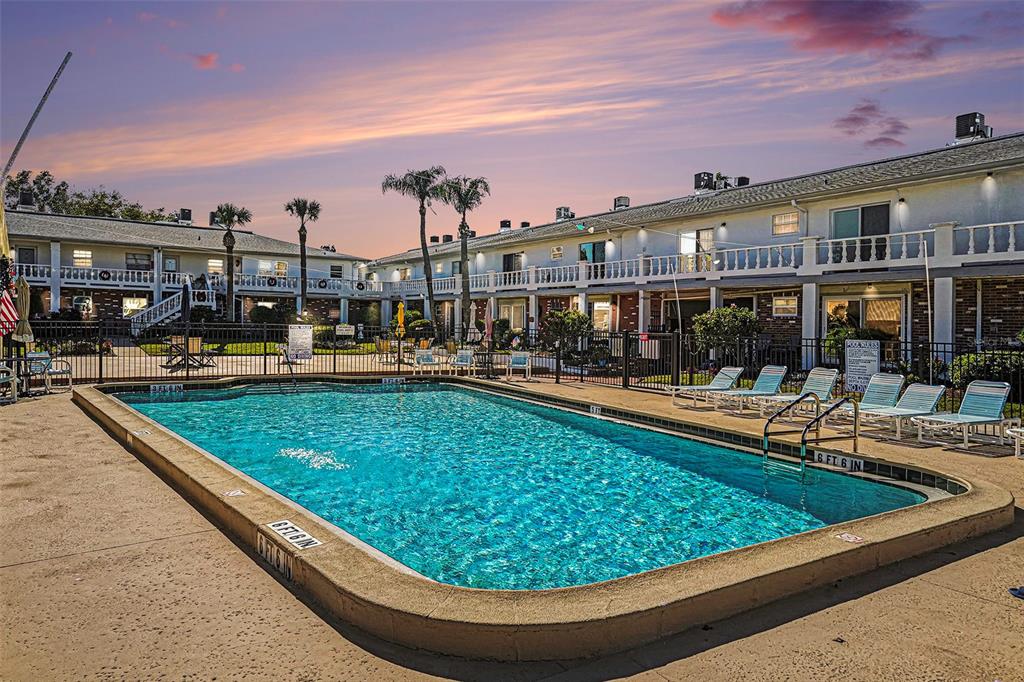 4742 Azalea Drive, Unit 103 New Port Richey, FL 34652 - Photo 27 of 33 a view of swimming pool with outdoor seating