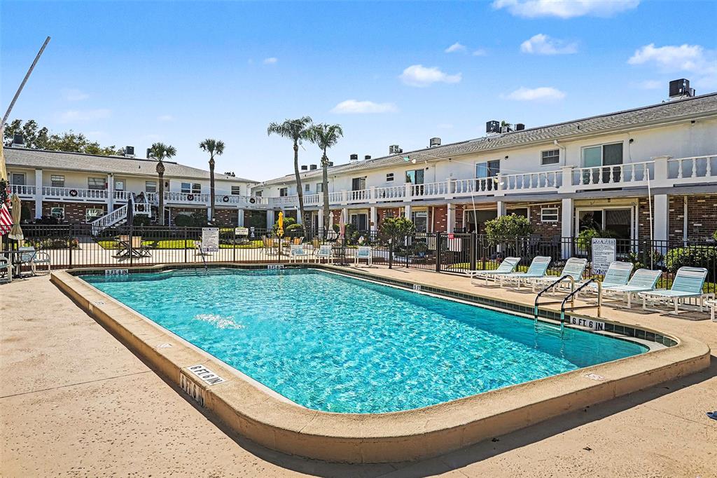 4742 Azalea Drive, Unit 103 New Port Richey, FL 34652 - Photo 28 of 33 a view of swimming pool with outdoor seating