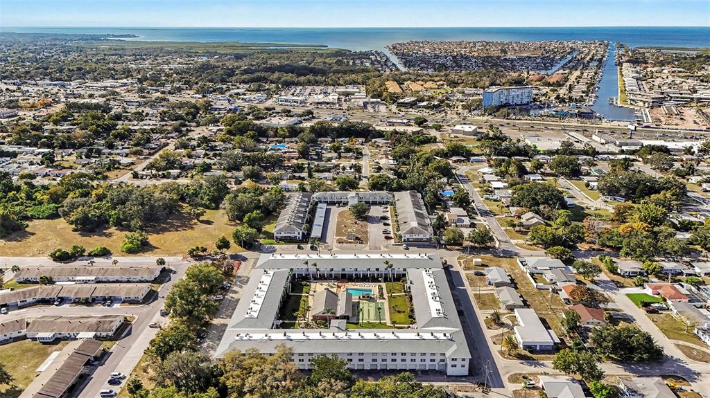 4742 Azalea Drive, Unit 103 New Port Richey, FL 34652 - Photo 32 of 33 an aerial view of a residential houses with city street view