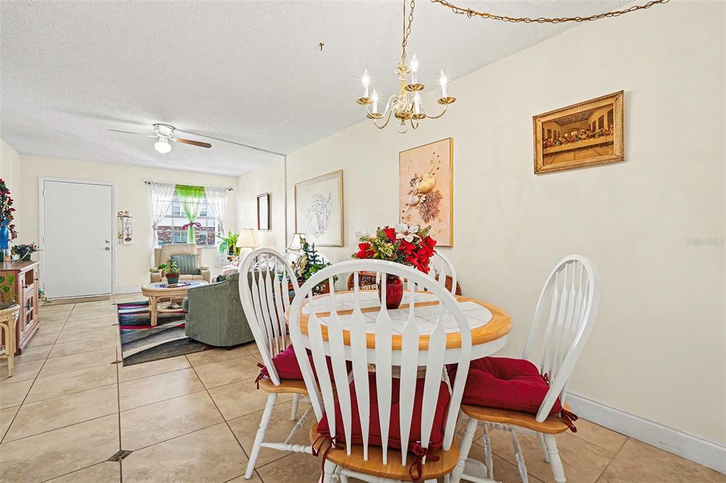 4742 Azalea Drive, Unit 103 New Port Richey, FL 34652 - Photo 10 of 33 a view of a dining room with furniture