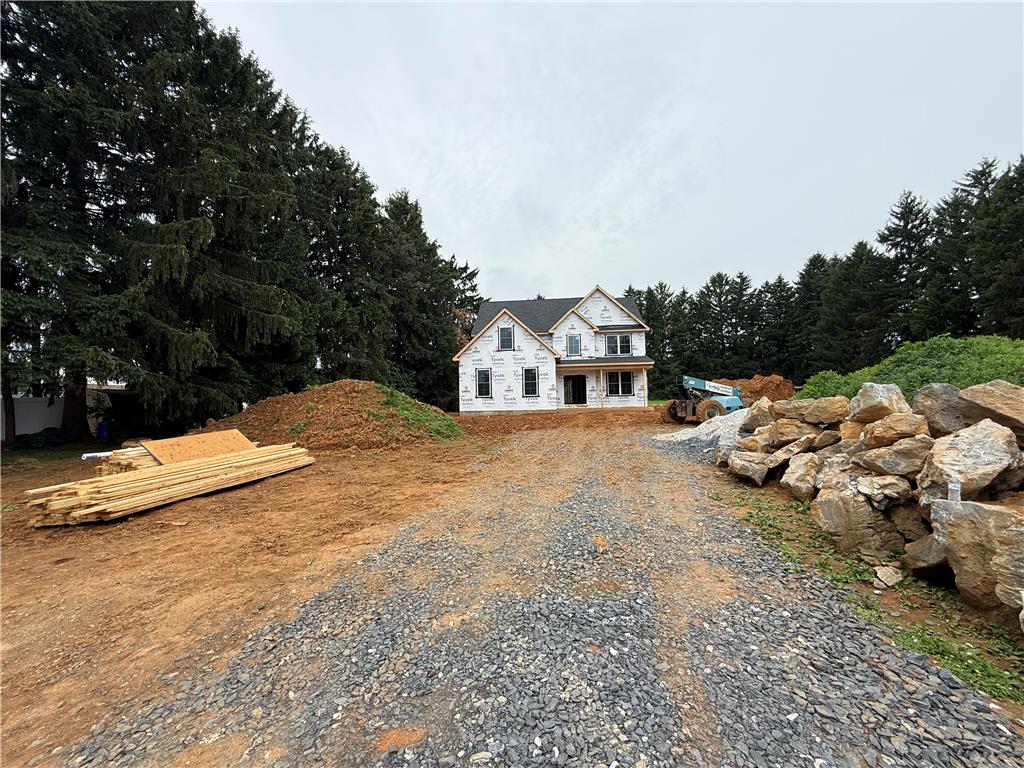 1551 Kelchner Road Bethlehem, PA 18018 - Photo 3 of 4 A new construction home awaits customization, set amidst mature trees and a spacious lot.