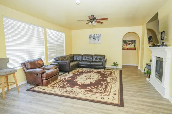 a living room with furniture and a fireplace