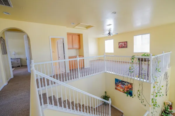 a view of a house with a yard and sitting area