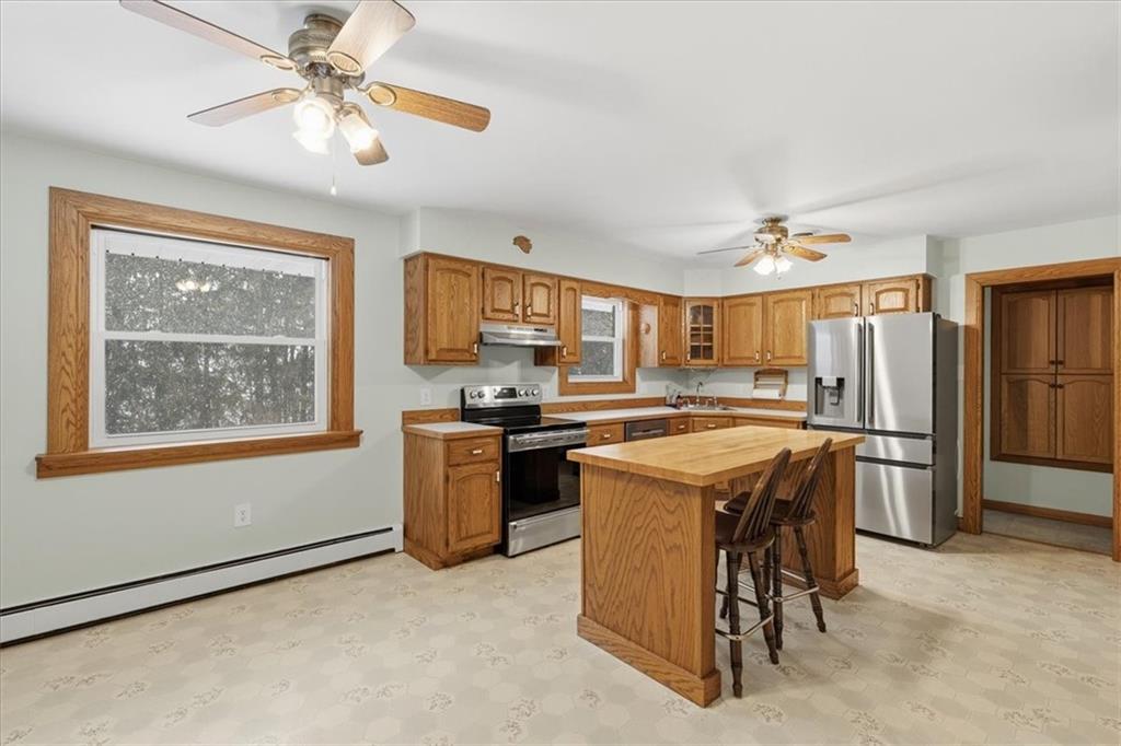 353 Thompson Hill Road Aliquippa, PA 15001 - Photo 16 of 49 a kitchen with refrigerator cabinets and furniture