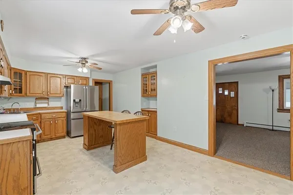 a view of a kitchen with a sink and cabinets