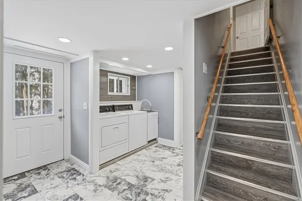 a view of entryway with kitchen