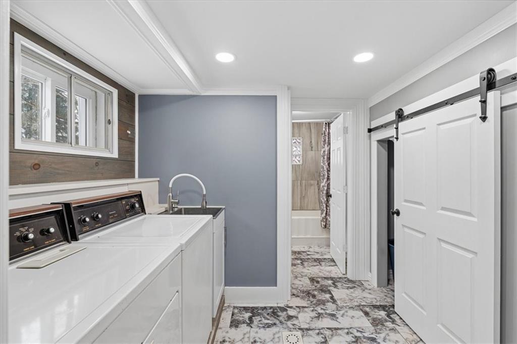 353 Thompson Hill Road Aliquippa, PA 15001 - Photo 22 of 49 a room with two washing machine and wooden floor