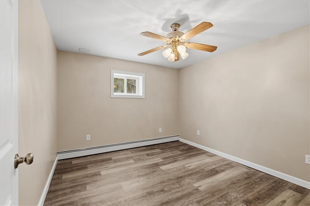 353 Thompson Hill Road Aliquippa, PA 15001 - Photo 28 of 49 wooden floor in an empty room with a window