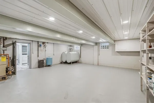 a view of an empty room with storage and utility