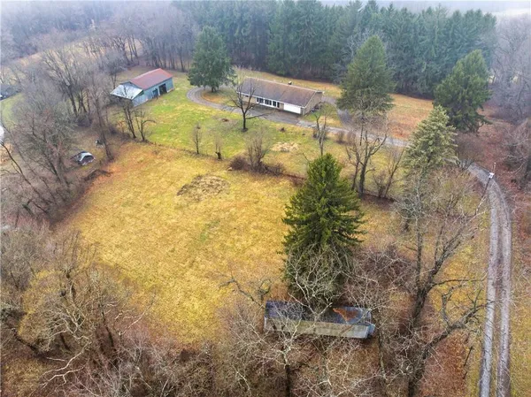 a view of a swimming pool with a yard