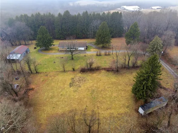 a view of a swimming pool with a yard