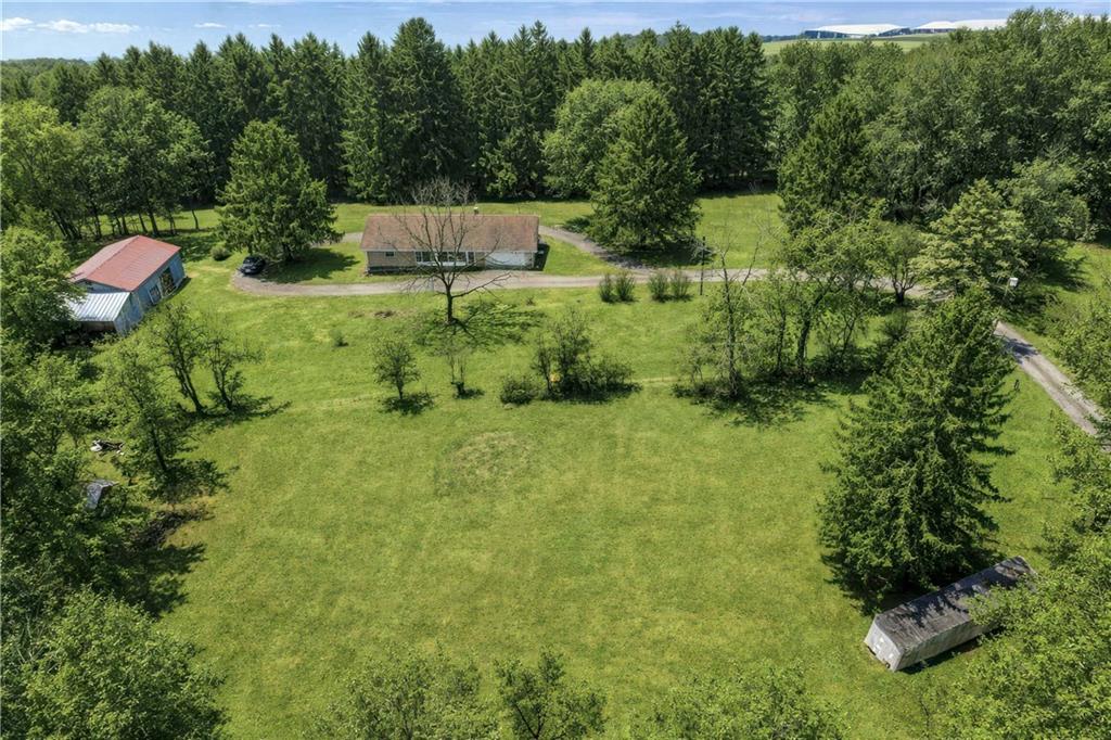 353 Thompson Hill Road Aliquippa, PA 15001 - Photo 48 of 49 a backyard of a house with lots of green space