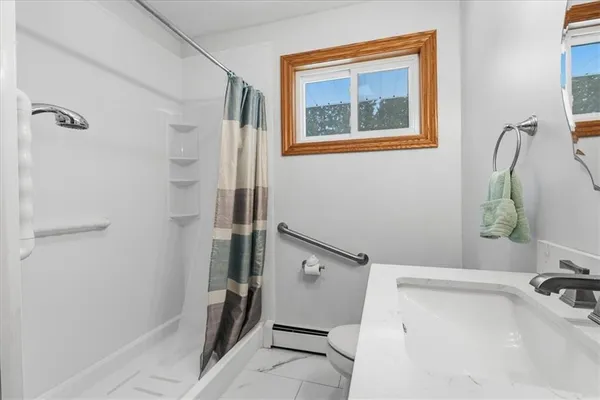a bathroom with a tub and a sink