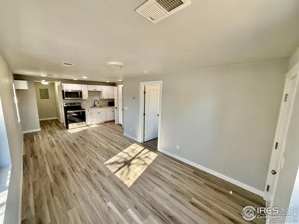 a view of living room with furniture and flat screen tv