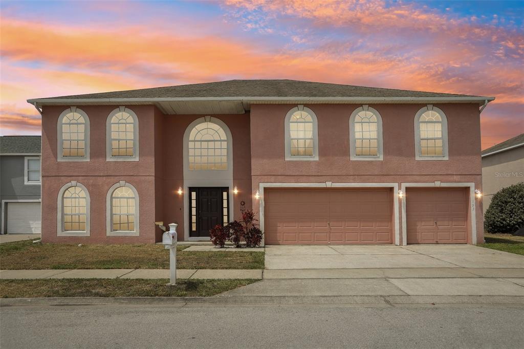 front view of a house with a yard