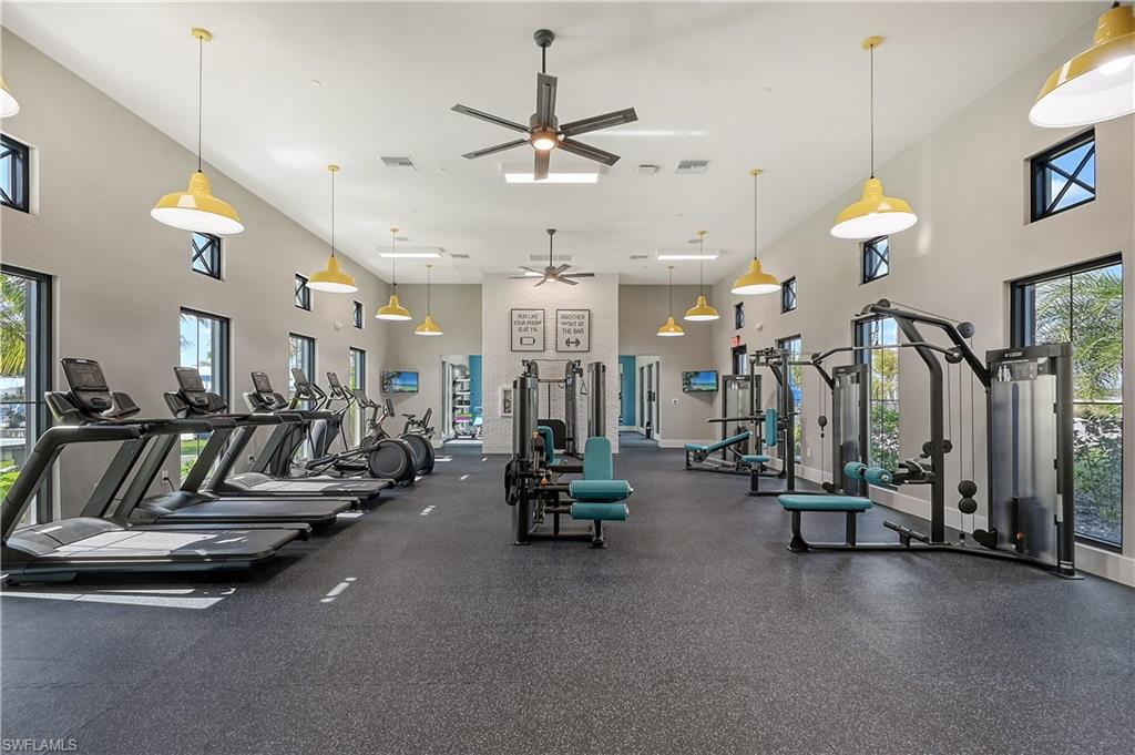 3946 Perseus Way Naples, FL 34120 - Photo 7 of 12 a view of a room with gym equipment