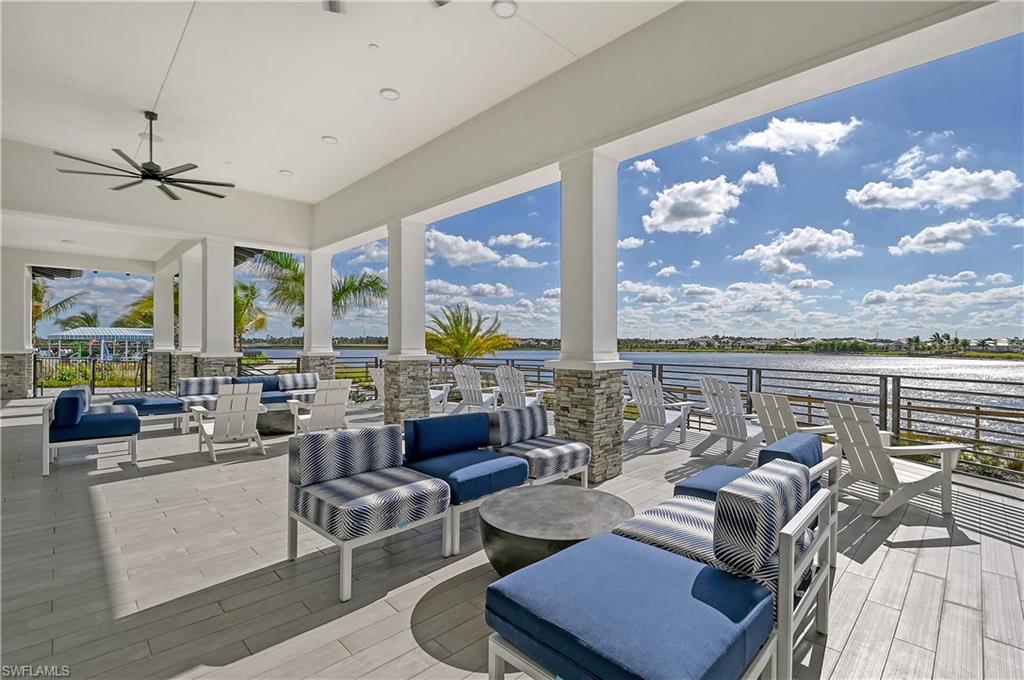3946 Perseus Way Naples, FL 34120 - Photo 8 of 12 a living room with patio furniture and a large window