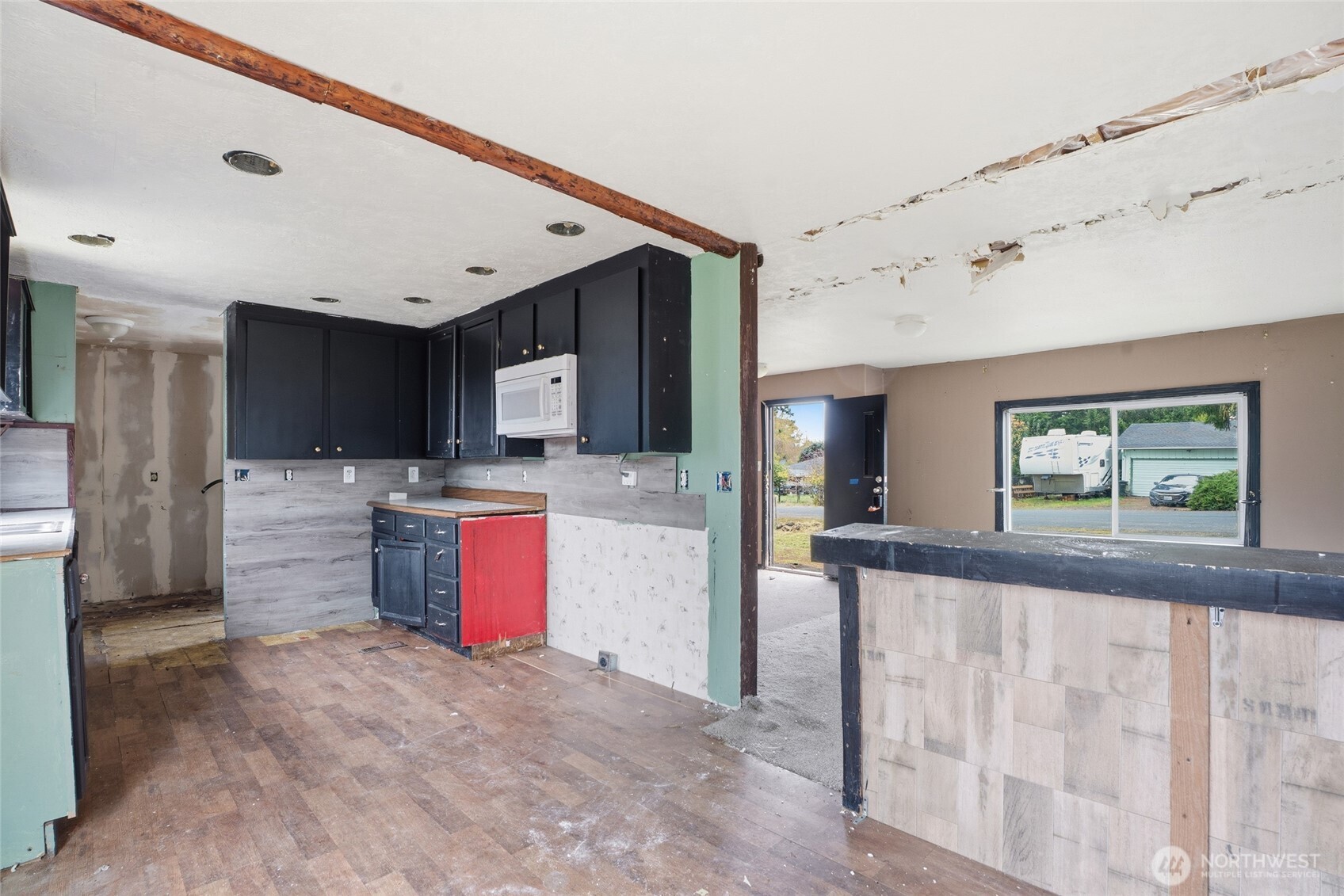 106 Wilford Road Silverlake, WA 98645 - Photo 13 of 32 a large kitchen with stainless steel appliances kitchen island granite countertop a refrigerator and a stove top oven