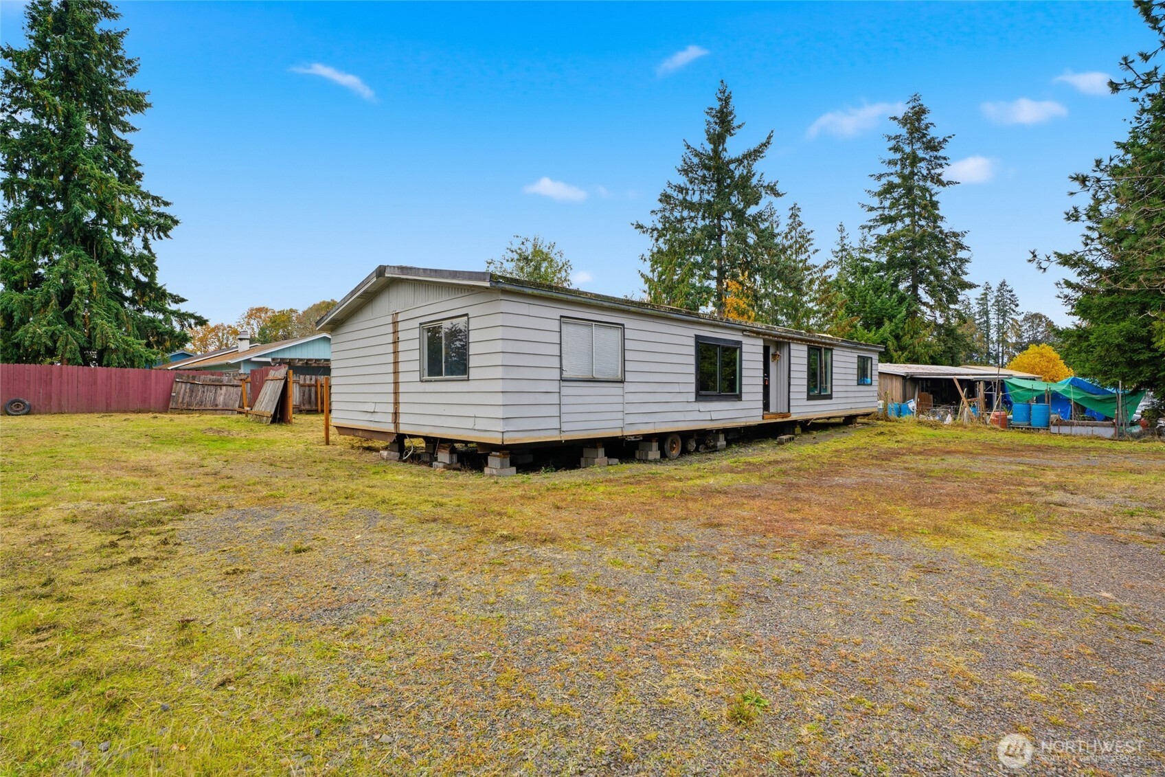 106 Wilford Road Silverlake, WA 98645 - Photo 8 of 32 a front view of a house with a yard and garage