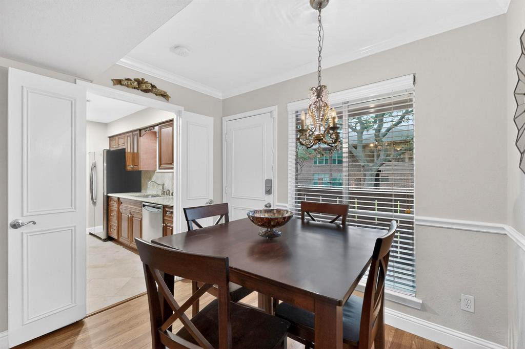 10534 Stone Canyon Road, Unit 111 Dallas, TX 75230 - Photo 5 of 14 a view of a dining room with furniture window and wooden floor