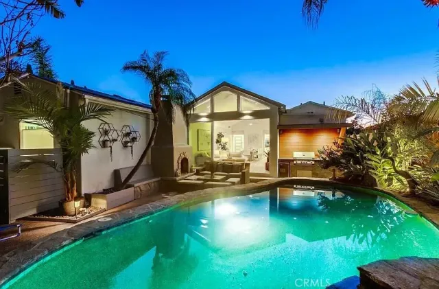 a view of a swimming pool with a yard