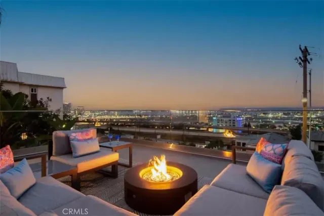 a outdoor living space with furniture and city view