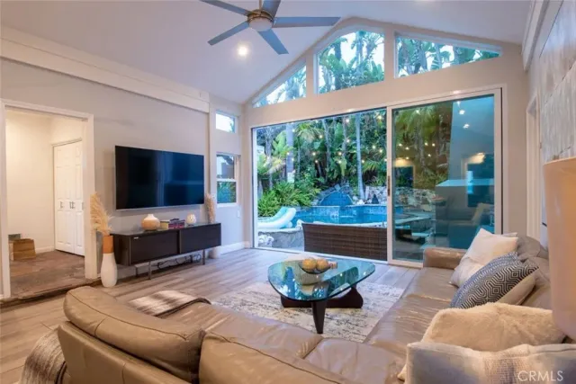 a kitchen with kitchen island granite countertop a sink a counter top space and cabinets