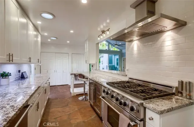 a bathroom with a double vanity sink toilet and shower