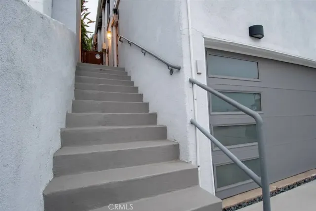 a kitchen with granite countertop a stove a sink and a microwave