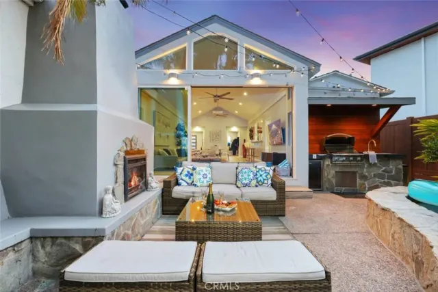 a living room with furniture a fireplace and a counter top space