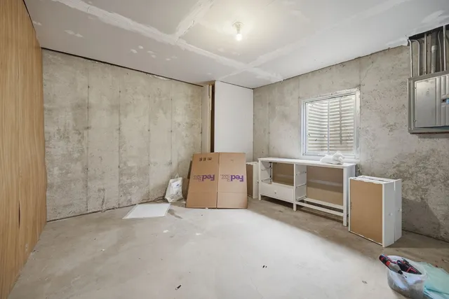 a view of a chairs and tables in the back yard