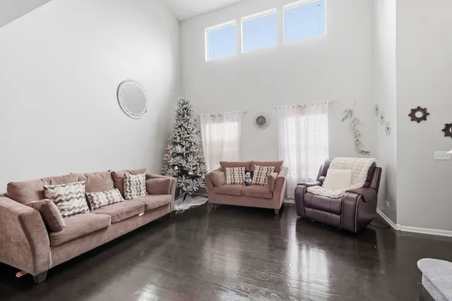 a living room with furniture or couch and a wooden floor