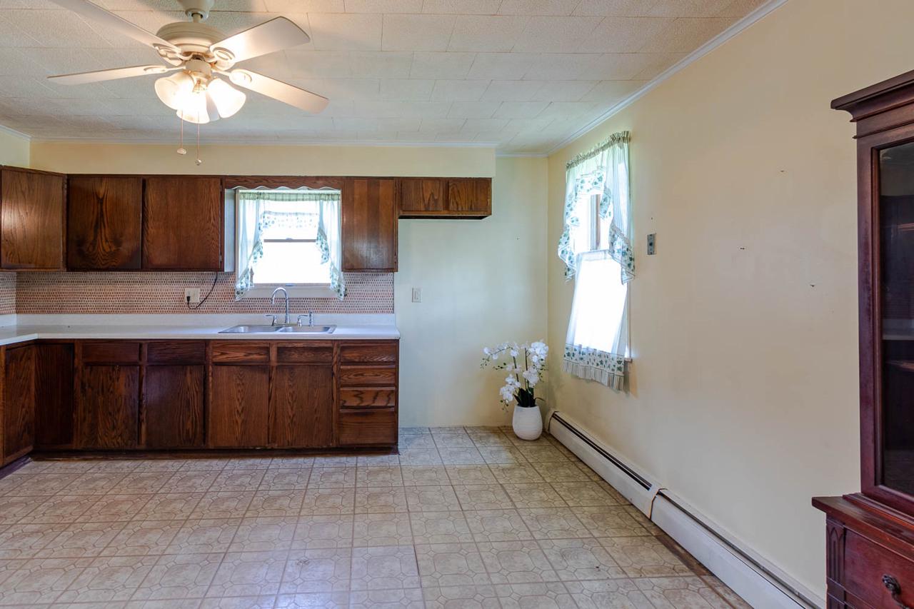 203 Gorton Road Moshannon, PA 16859 - Photo 6 of 39 a spacious bathroom with a granite countertop sink a window and a mirror