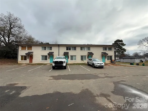 a kitchen with kitchen island sink and refrigerator