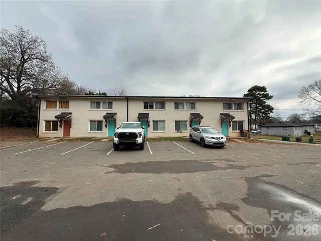 a kitchen with kitchen island sink and refrigerator