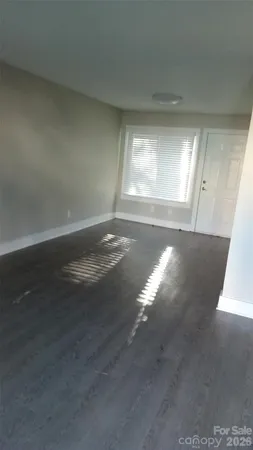 a kitchen with a refrigerator and window