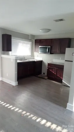 a white toilet sitting next to a bath tub