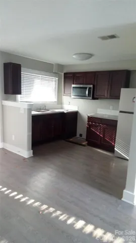 a white toilet sitting next to a bath tub