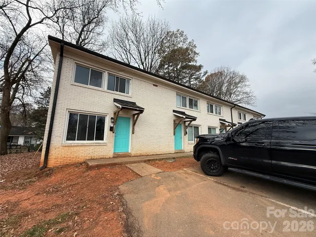a car parked in front of a house