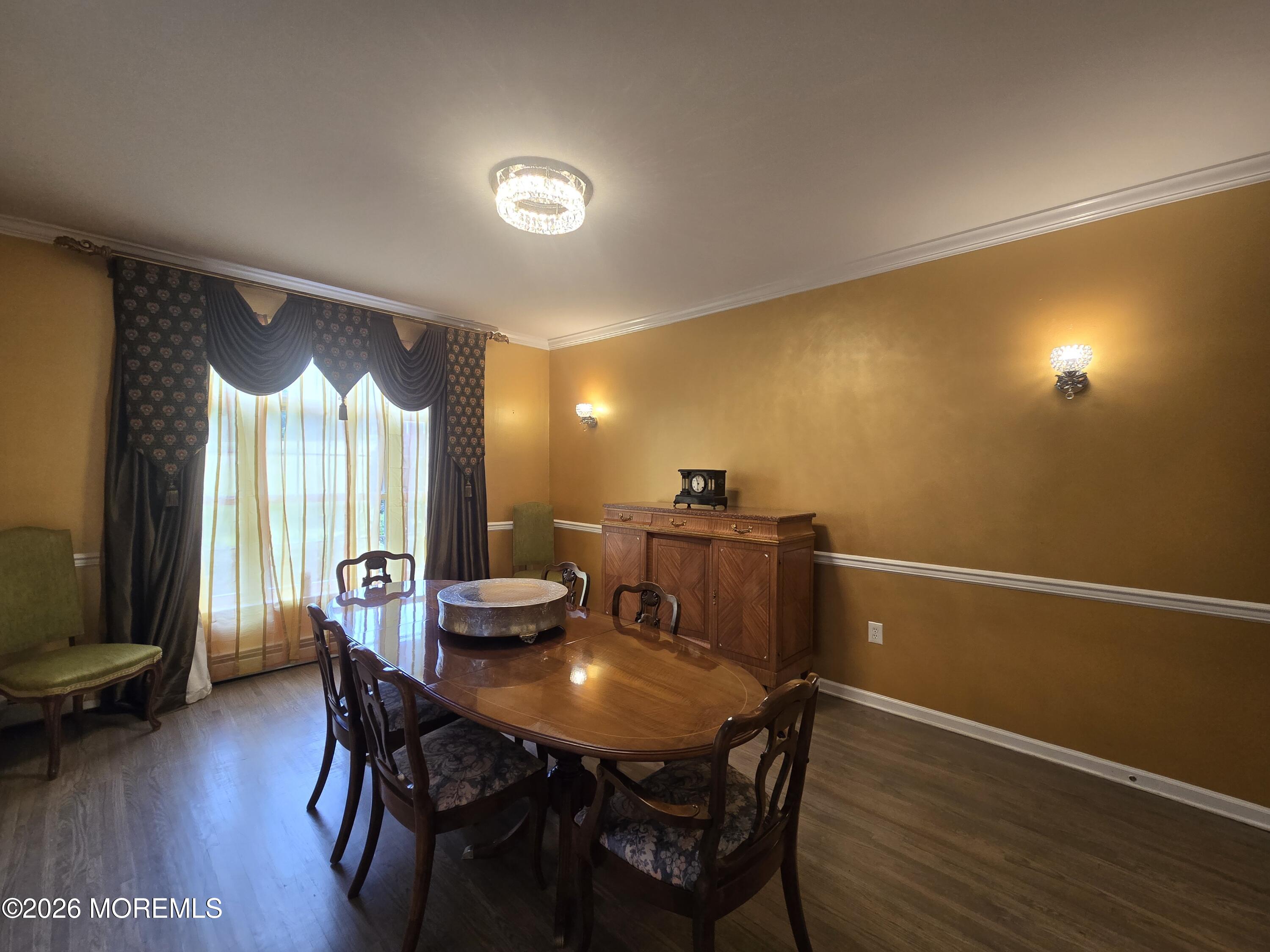 112 Beacon Hill Road Morganville, NJ 07751 - Photo 19 of 53 a view of a dining room with furniture and wooden floor