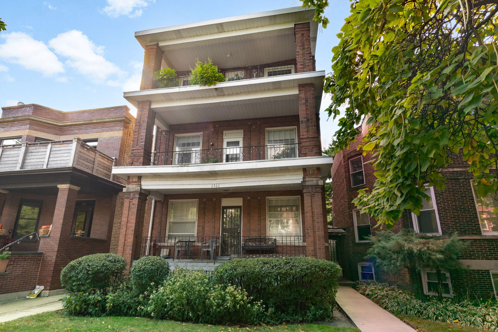 front view of a house with a small yard