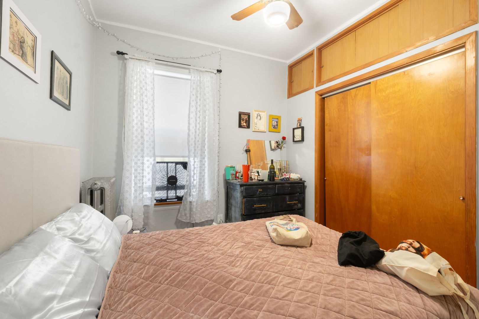 1311 West Thorndale Avenue Chicago, IL 60660 - Photo 23 of 28 a bedroom with a bed and wooden floor