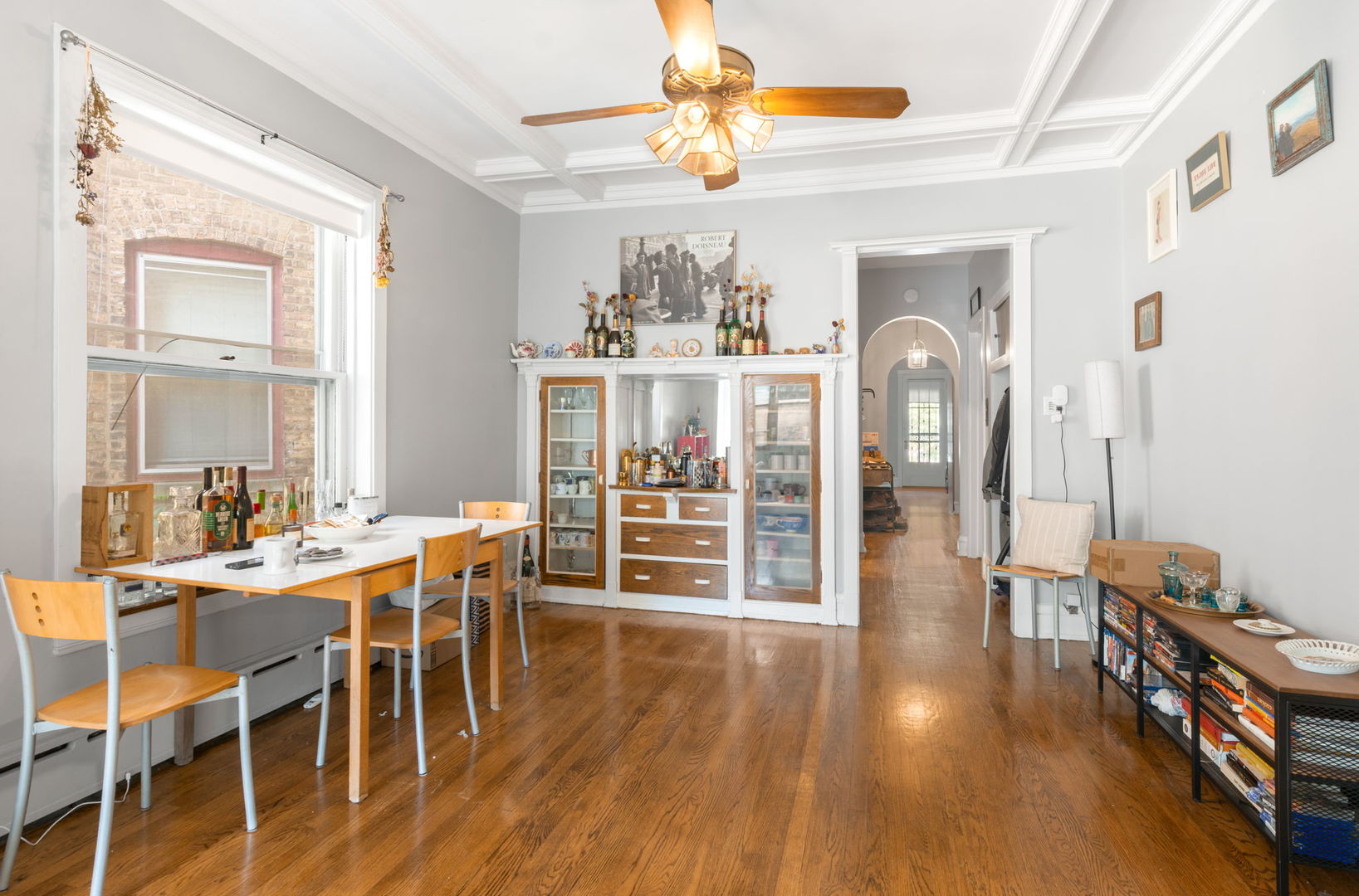 1311 West Thorndale Avenue Chicago, IL 60660 - Photo 3 of 28 a view of a dining room with furniture window and wooden floor