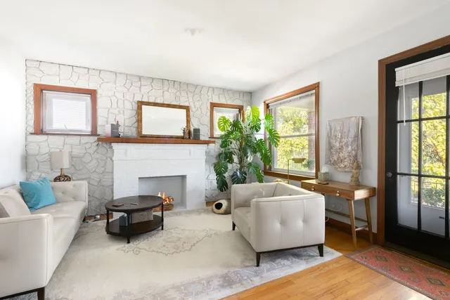 a living room with furniture and a fireplace