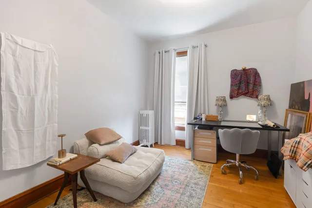 a work room with furniture and a window